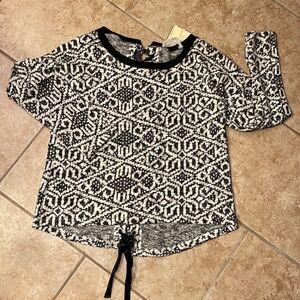 Black and white faux leather lace back top